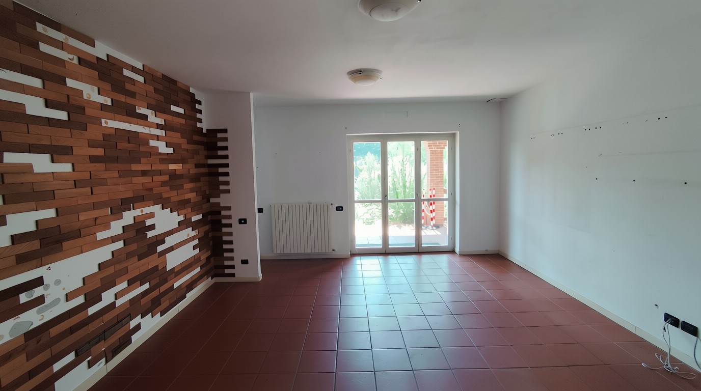 Soggiorno luminoso della villa con accesso al portico